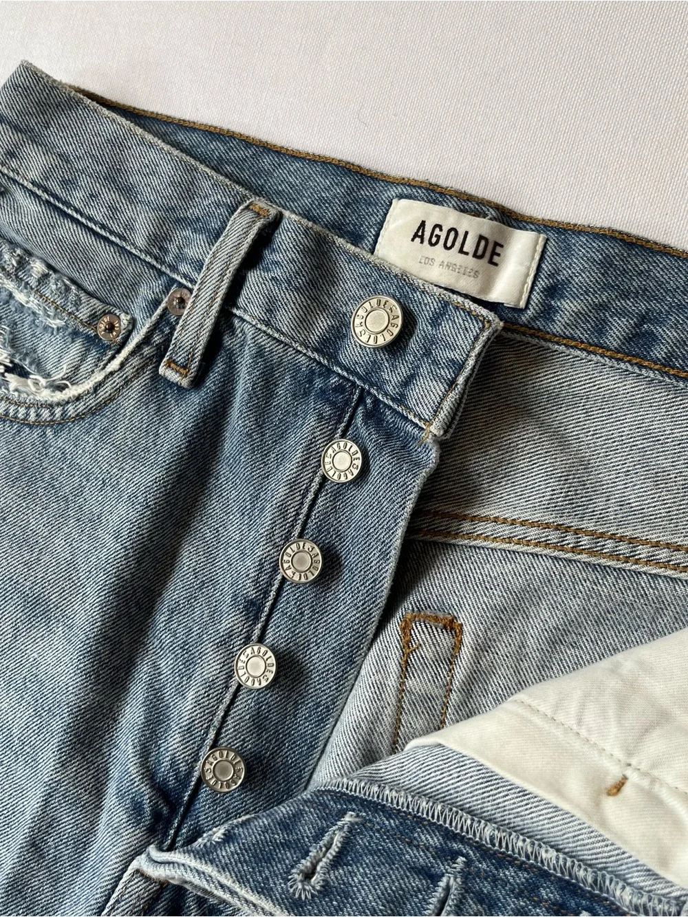 AGOLDE Riley cut off denim shorts 26 High rise Button fly Light wash Distressed